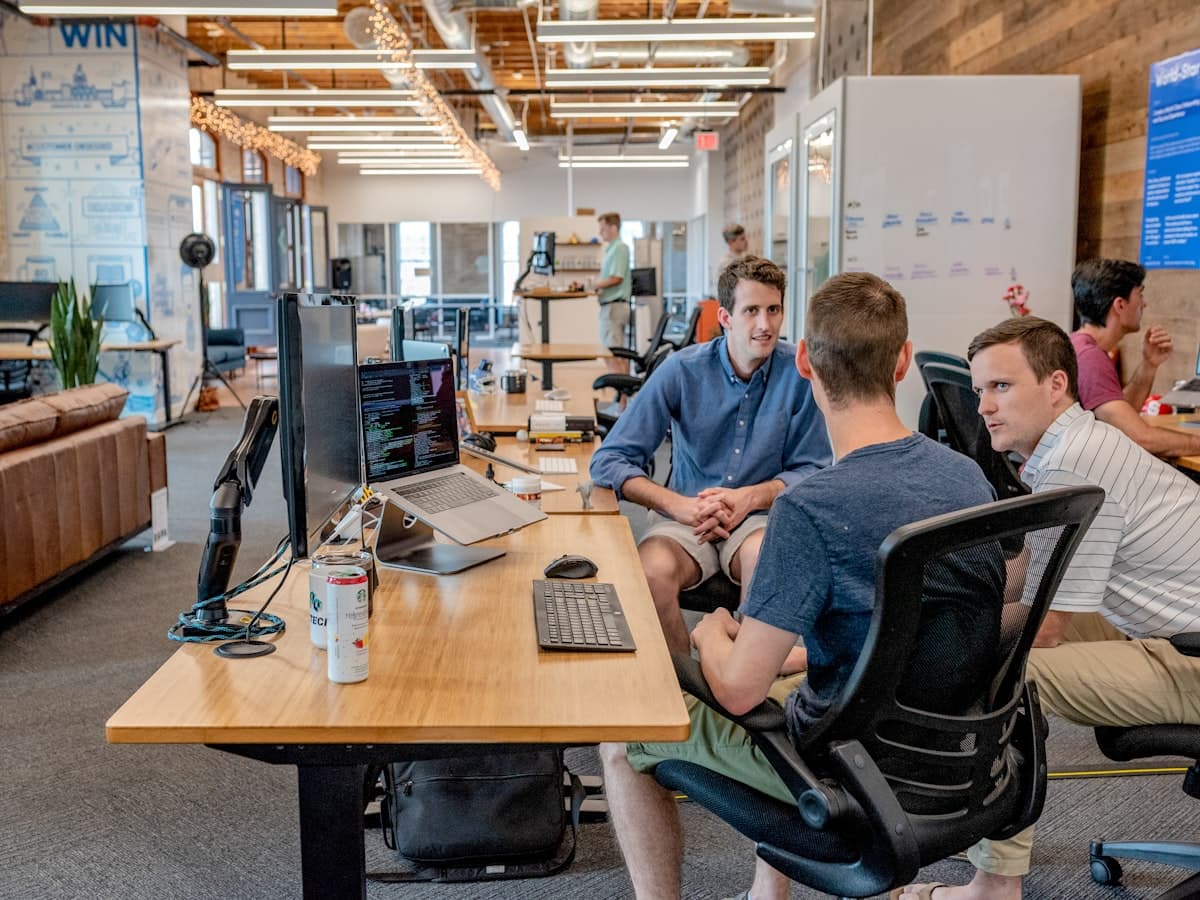 Marketing team reviewing creator profiles on a screen